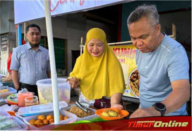 
					Makan Nasi Kuning di Pasar Malili, Bupati Lutim Diserbu Pengunjung